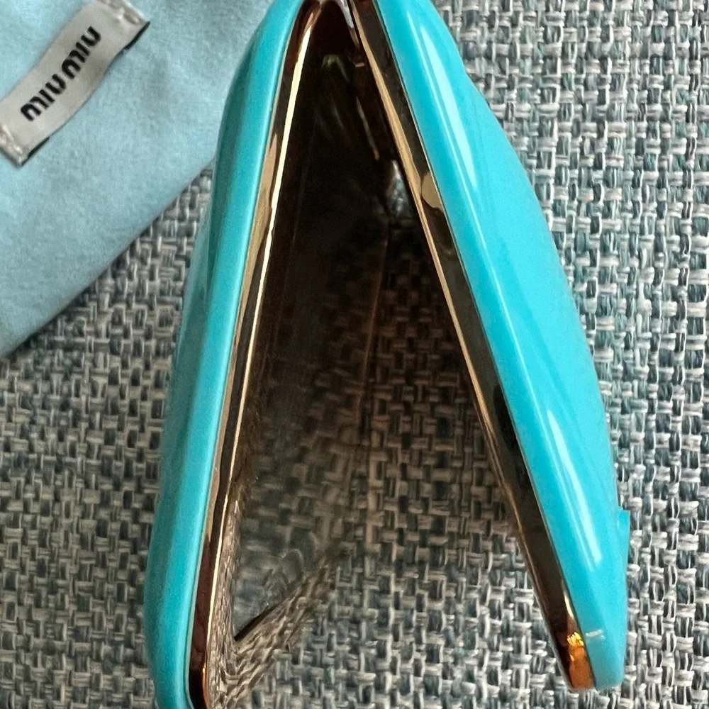 39. Miu Miu Turquoise Compact Case
